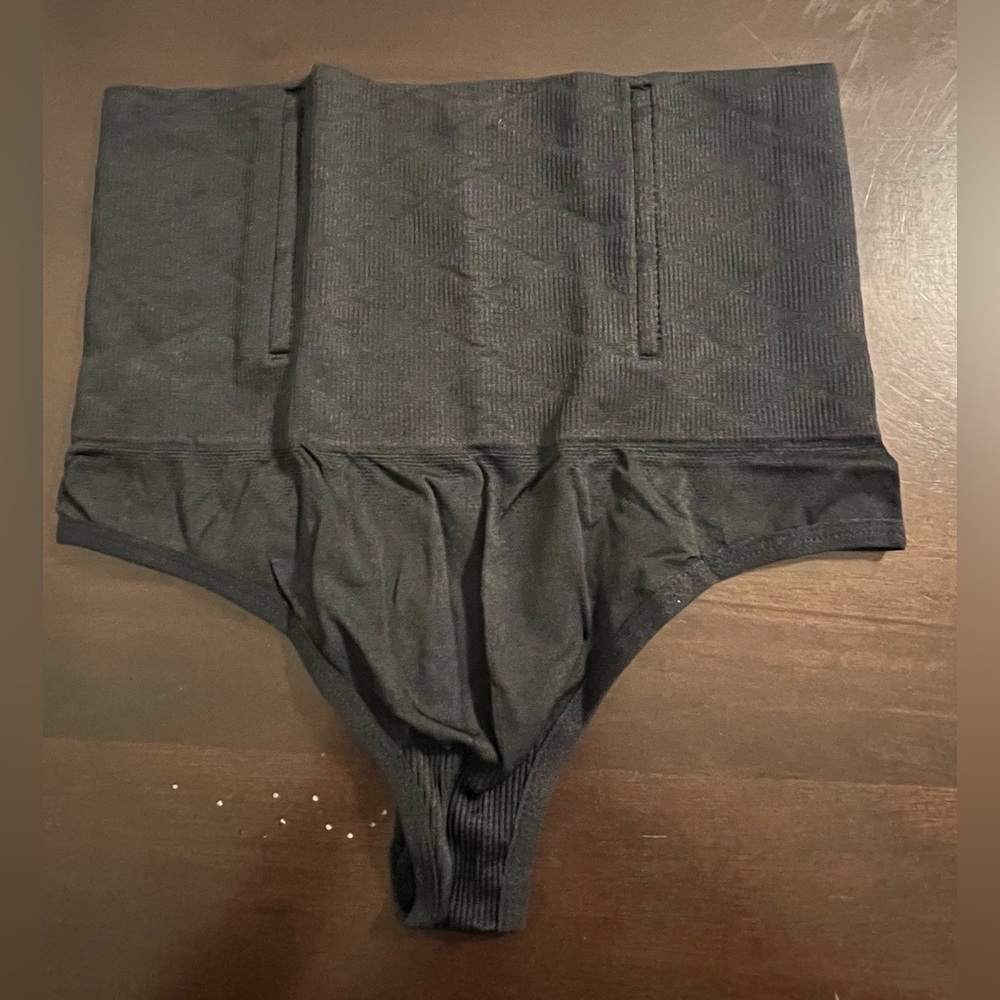 Women’s black thong shape-wear panties. Size L. NWOT
